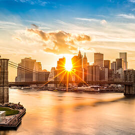 Brooklyn Bridge and the Lower Manhattan skyline at sunset by Mihai Andritoiu