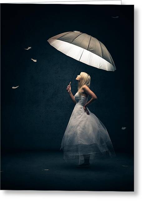 Woman Holding Umbrella with Floating Feathers Greeting Card