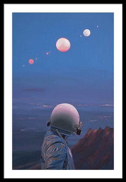 Astronaut Gazing at Moons Framed Print