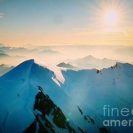Sunrise Over Snow-Capped Mountain Peaks